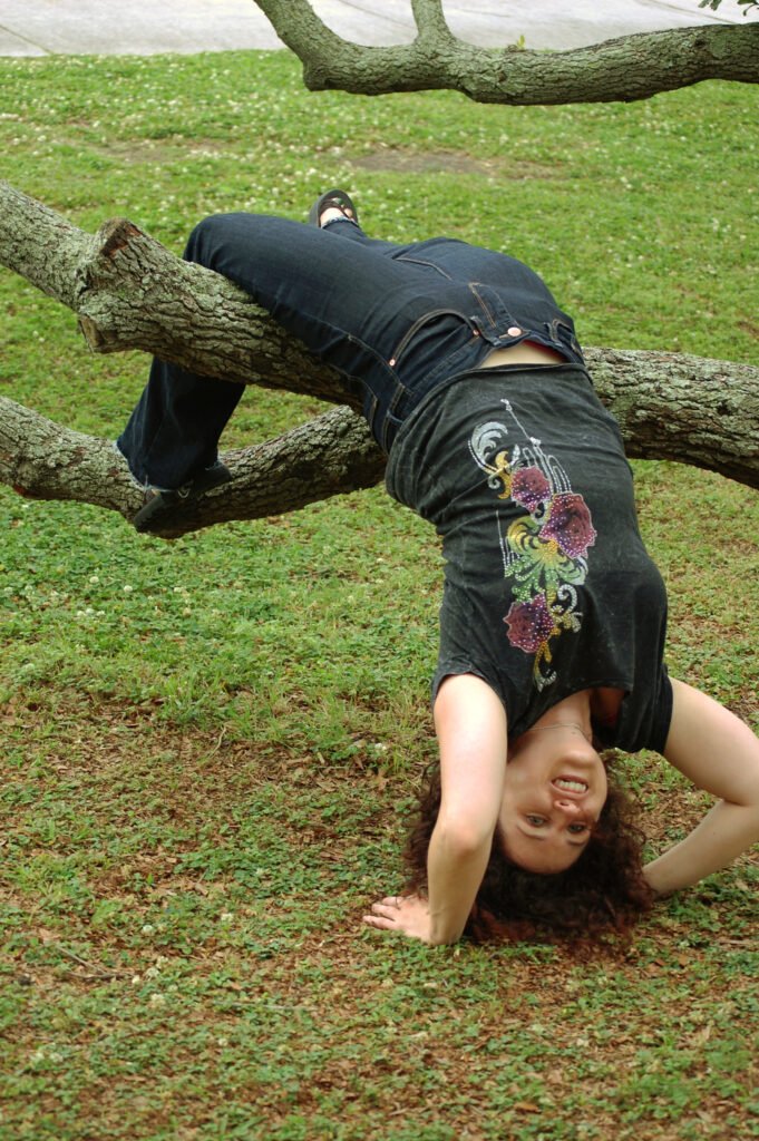 30year old me in New Orleans upside down from a  tree